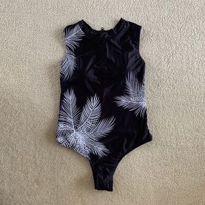 Black surfer bathing suit with white palm fronds